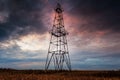 Abandoned oil rig, dramatic clouds and evening sky Royalty Free Stock Photo