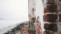 Abandoned old building red brick walls in middle of frozen lake