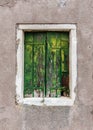 Abandoned old green window shutters Royalty Free Stock Photo