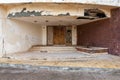 Abandoned old grunge wooden double leaves door and brown stone bricks wall Royalty Free Stock Photo