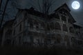 Abandoned old haunted house with dark horror atmosphere in the moonlight Royalty Free Stock Photo