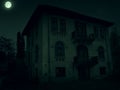 Abandoned old haunted house with dark horror atmosphere in the moonlight Royalty Free Stock Photo