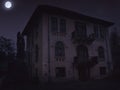 Abandoned old haunted house with dark horror atmosphere in the moonlight Royalty Free Stock Photo