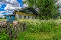 Abandoned old house in a Russian village with ornaments on the f Royalty Free Stock Photo