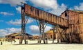 Abandoned old industrial buildings in desert landscape, salpeter mining village closed 1960 - Santa Laura ghost town, Chile Royalty Free Stock Photo