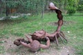 Abandoned old iron rusty sculpture of scorpion in the forest. Royalty Free Stock Photo