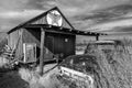 Abandoned old pickup truck in front of deserted Texaco Station, remote part of Nebraska