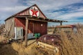Abandoned old pickup truck in front of deserted Texaco Station, remote part of Nebraska