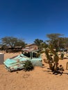 Abandoned old rusty car. Body of a retro car in the sands. Desert in Namibia. Royalty Free Stock Photo