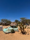 Abandoned old rusty car. Body of a retro car in the sands. Desert in Namibia. Royalty Free Stock Photo