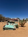 Abandoned old rusty car. Body of a retro car in the sands. Desert in Namibia. Royalty Free Stock Photo