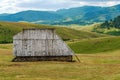 Abandoned old shepherd cottage on pasture land hill in Zlatibor region in Serbia Royalty Free Stock Photo