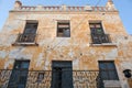 Abandoned old stone greek yellow house on Corfu island, Greece Royalty Free Stock Photo