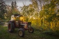 Abandoned old tractor sunset shot Royalty Free Stock Photo