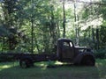 Abandoned rusty antique truck in woods Royalty Free Stock Photo