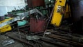 Abandoned old, useless details of machine tools in workshop, metal scrap. Many different parts of broken, outdated
