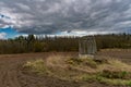 Abandoned old water well in a middle of a field. Royalty Free Stock Photo