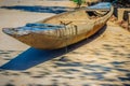 Abandoned old wooden boat on the shore. Shipwrecked wooden fishing boat on the land.