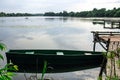 Abandoned Old Wooden Fishing Boat Near Pier In Summer Lake Or River. Beautiful Summer Sunny Day Or Evening. Forsaken Boat Royalty Free Stock Photo