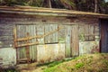 Abandoned old wooden house with closed windows Royalty Free Stock Photo