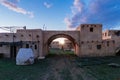 Abandoned oriental village. Ruined houses with straw roofs