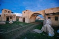 Abandoned oriental village. Ruined houses with straw roofs