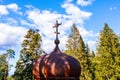 Abandoned Orthodox Church in the forest, Galgauska, Latvia, cross on the roof dome, close-up Royalty Free Stock Photo