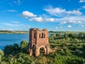 Abandoned Orthodox church on lake shore from drone Royalty Free Stock Photo