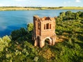 Abandoned Orthodox church on lake shore from drone Royalty Free Stock Photo