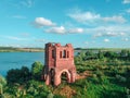 Abandoned Orthodox church on lake shore from drone Royalty Free Stock Photo