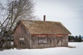 abandoned outhouse on a field Royalty Free Stock Photo
