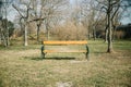 Abandoned park bench in autumn or winter season. Waiting moment, tranquility scene and simplicity concept