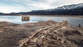 Abandoned and partially submerged stone building in lake in Corsica