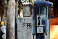 Old rustic abandoned payphone on the street in Jakarta Royalty Free Stock Photo