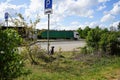 Abandoned pet dog leashed on parking sign pole Royalty Free Stock Photo