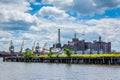 Abandoned pier in Fells Point and the Domino Sugars Factory in Baltimore, Maryland