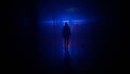 Portrait of female in the dark hallway with neon light. Woman with flashlight walking down the corridor with door and