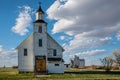 The abandoned Plato United Church with the Plato grain elevator in Plato, Saskatchewan, Canada Royalty Free Stock Photo