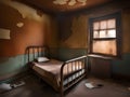 Abandoned prison cell room with old rusty bed frame and peeling walls Royalty Free Stock Photo