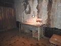 An abandoned prison in an underground bunker. A former Soviet cold war bomb shelter. The sealed door of the bunker. Pipes and