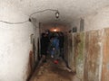 An abandoned prison in an underground bunker. A former Soviet cold war bomb shelter. The sealed door of the bunker. Pipes and