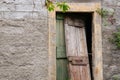 Abandoned property with broken wooden door