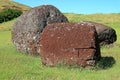 Abandoned Moai Statue`s Topknot with the Ancient Petroglyph on Red Scoria Stone at Puna Pau Volcano, Easter Island, Chile Royalty Free Stock Photo