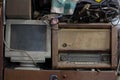 Abandoned radio and computer standing near, technology stretching back in time