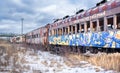 Abandoned railroad cars under threatening winter sky. Albany County, NY.