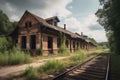 abandoned railway station, with old train cars and tracks left behind Royalty Free Stock Photo