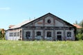 Abandoned railway station service brick building with broken doors and windows