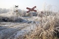 Abandoned railway track in freezing weather, rail crossing, sunny freezing weather, little dusting of snow