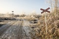 Abandoned railway track in freezing weather, rail crossing, sunny freezing weather, little dusting of snow Royalty Free Stock Photo