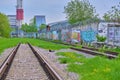 abandoned railway tracks in an industrial zone color Royalty Free Stock Photo